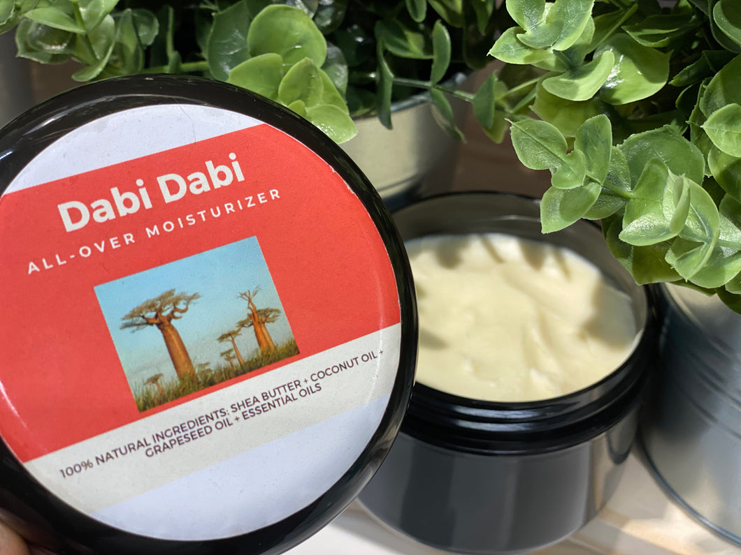 Dabi Dabi All-Over Moisturizer: shea butter, coconut oil, grape seed oil & essential oils. 100% natural. Woman & Black-owned.